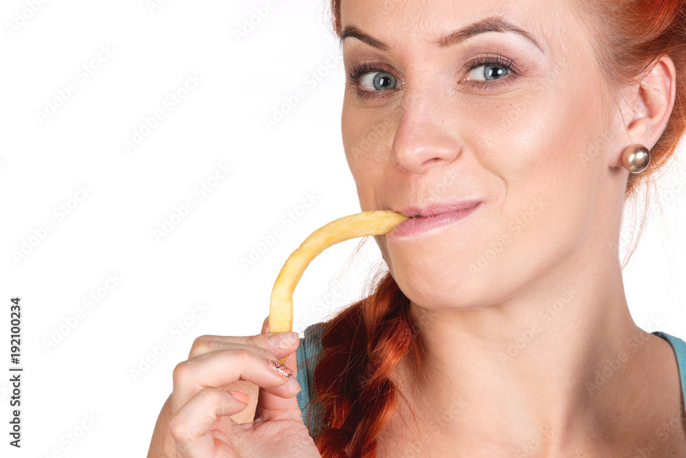 portrait of young woman eating french fries close up portrait of young woman eating french fries close up