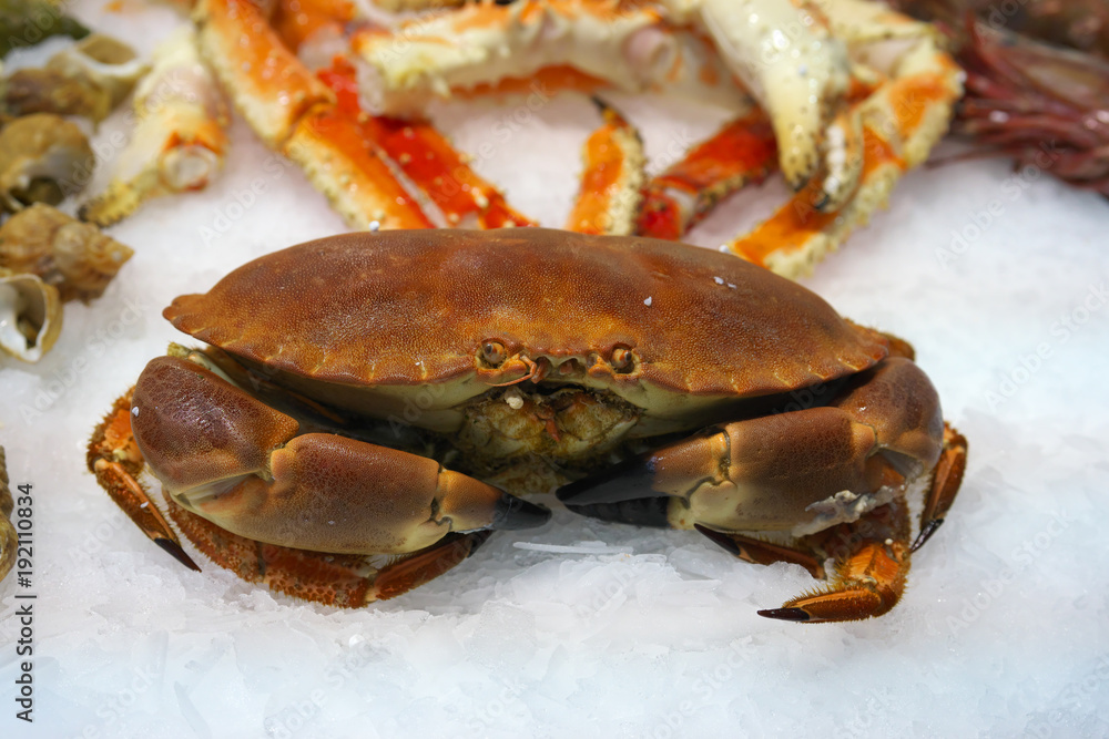 Paris,France-January 27 2018: Seafood displayed on a fishmongers counter in Paris Paris,France-January 27 2018: Seafood displayed on a fishmongers counter in Paris