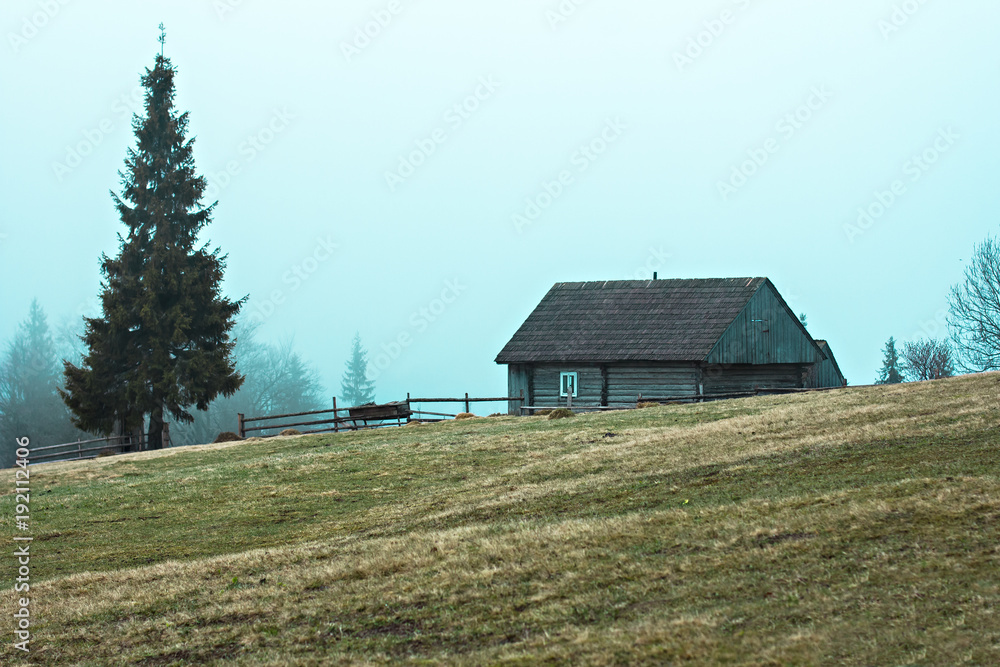 Mountain landscape in the fog. house in the mountains. Carpathian mountains. Mountain landscape in the fog. house in the mountains. Carpathian mountains.