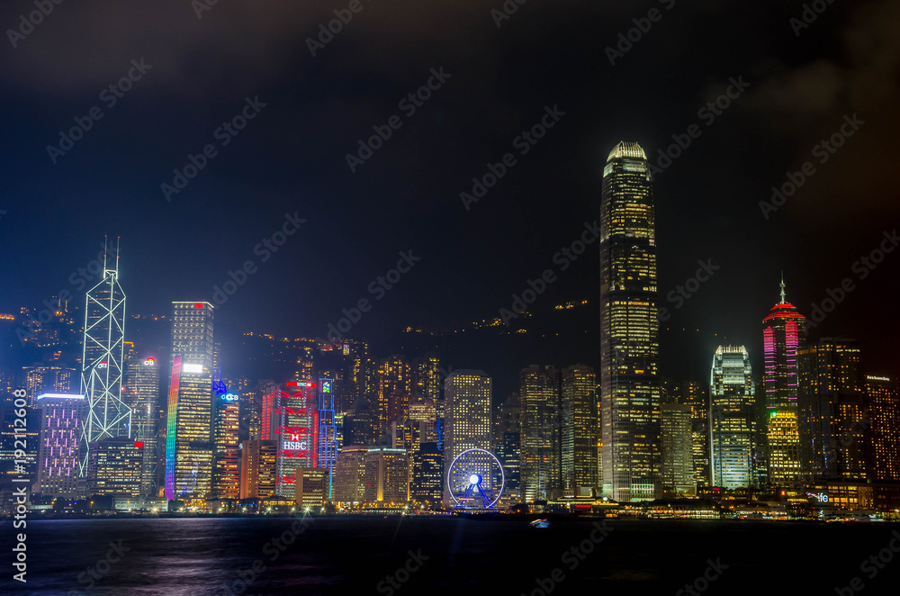 HONG KONG - NOVEMBER 15, 2016: Hong Kong skyline of Hong Kong Island with city lights viewed from Tsim Tsa Tsui waterfront across Victoria Harbor.