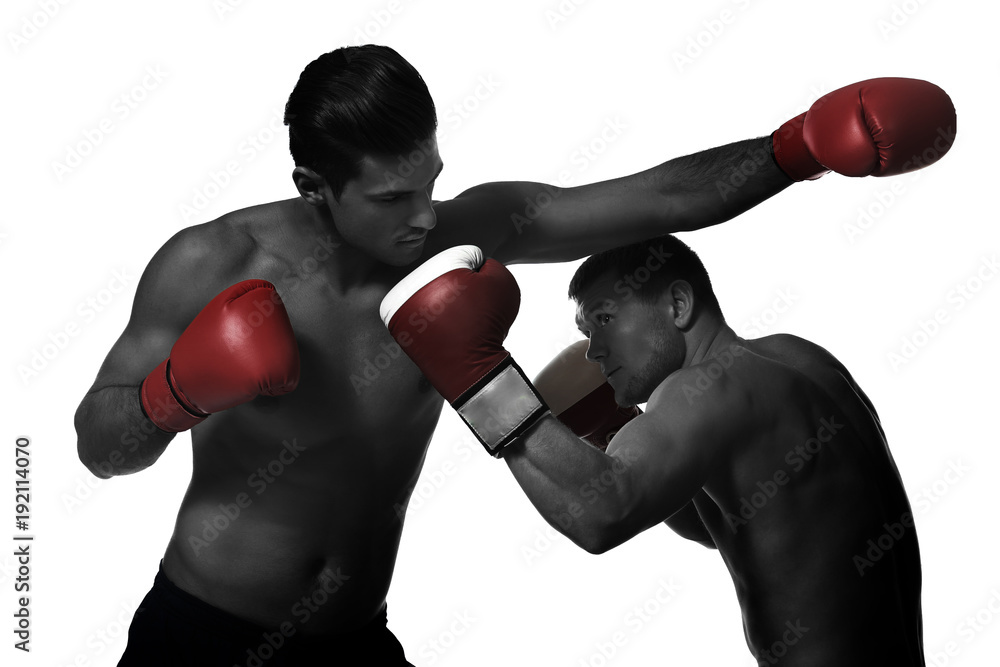 Young boxers fighting on white background