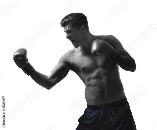 Young man with boxing gloves on white background