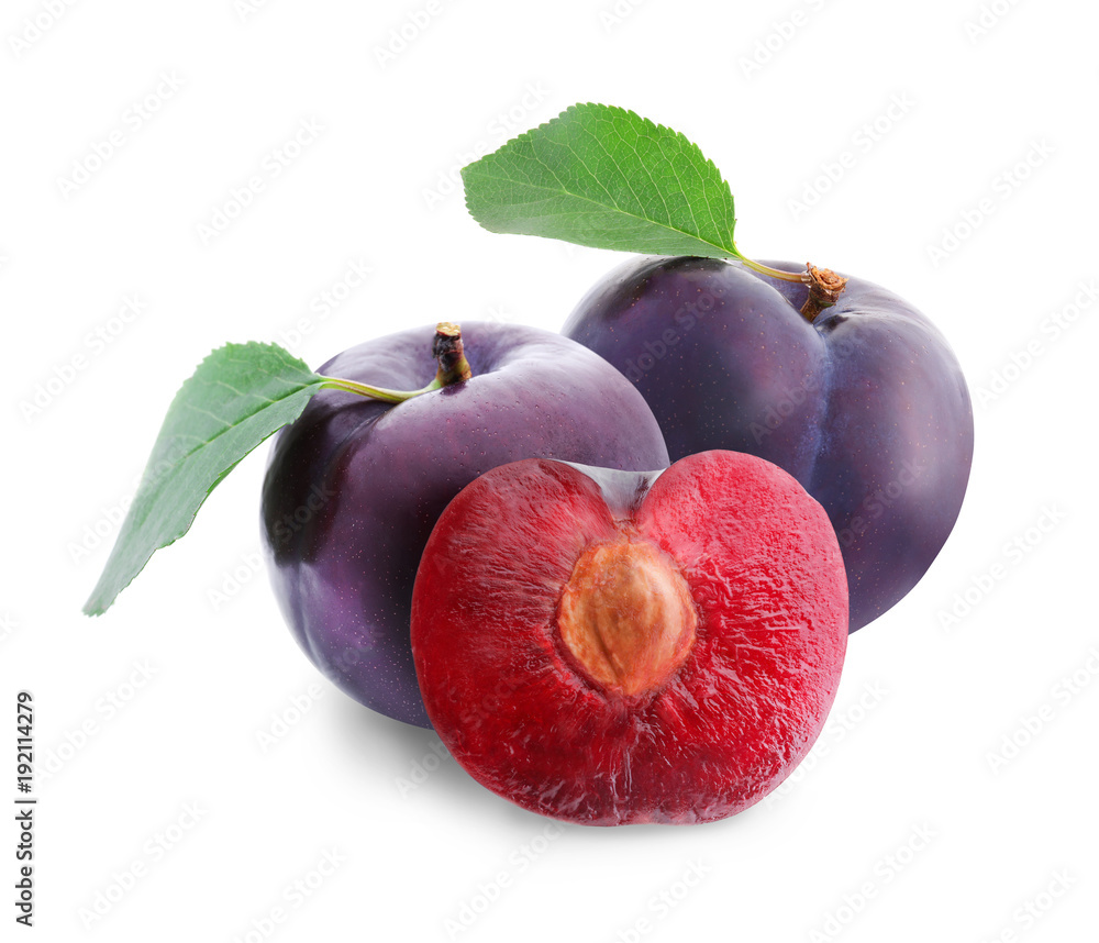 Ripe sweet plums on white background