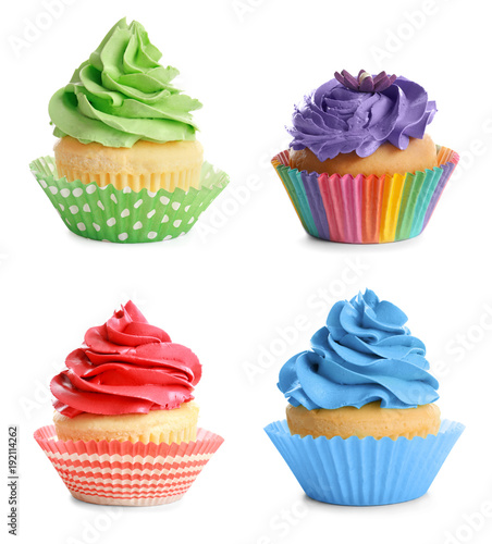 Set of tasty colorful cupcakes on white background