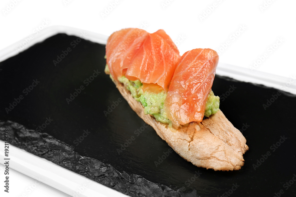 Slate plate with tasty bruschetta on white background Slate plate with tasty bruschetta on white background