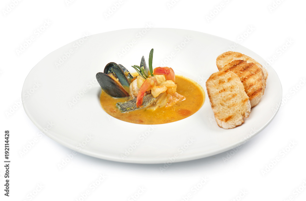 Plate of tasty bouillabaisse on white background