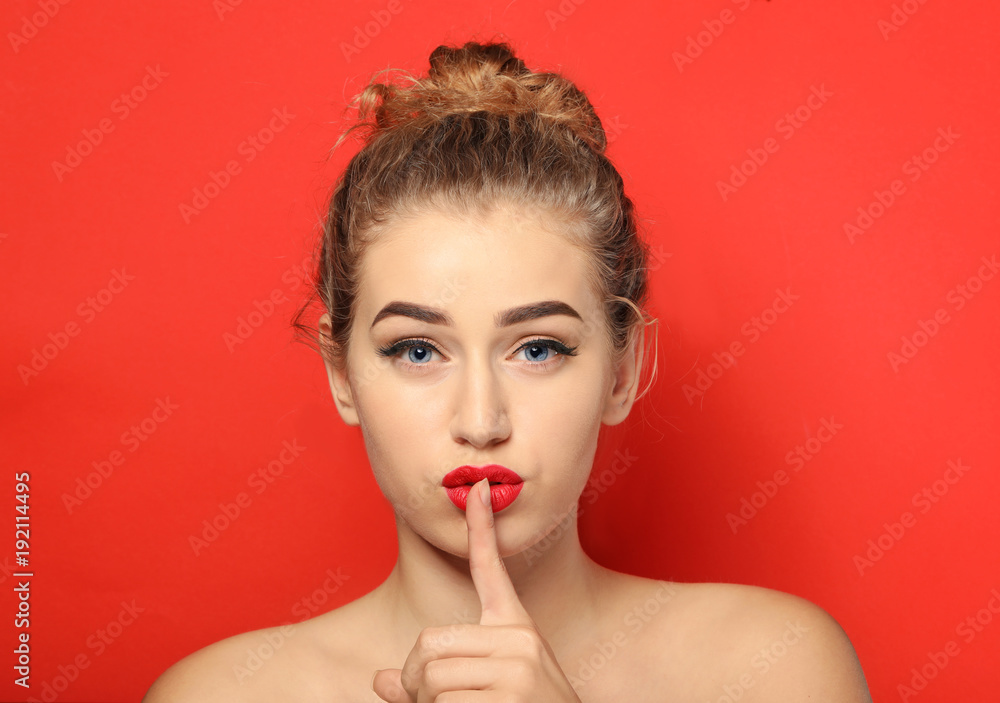Portrait of young woman with beautiful eyebrows on color background Portrait of young woman with beautiful eyebrows on color background
