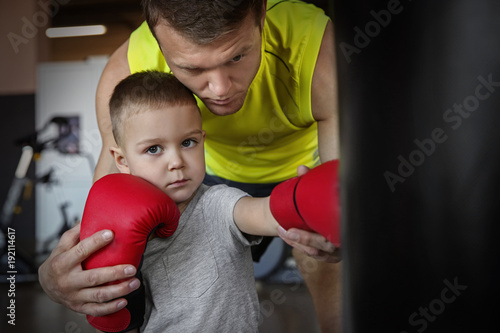 Little boy training with co...