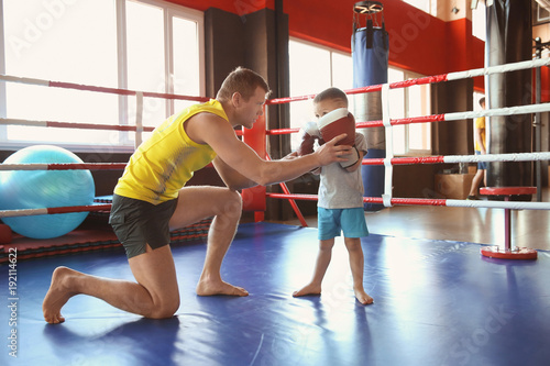 Little boy training with co...