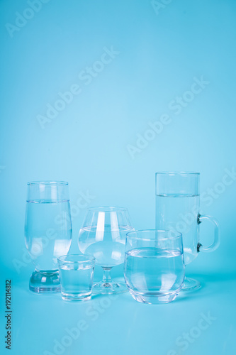 Transparent water in different glasses