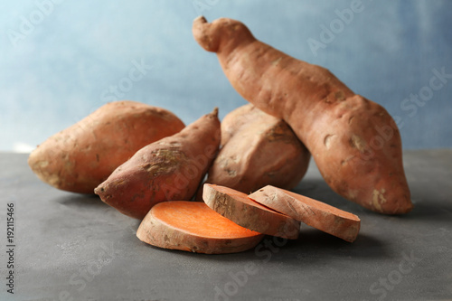 Sweet potatoes with slices on table