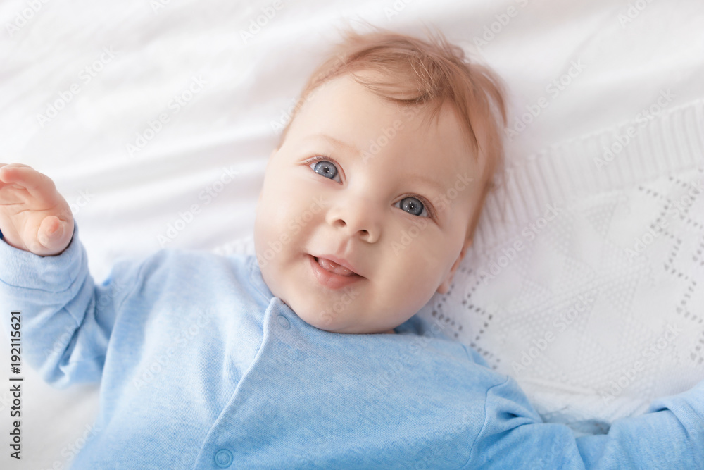 Cute little baby lying on bed, top view Cute little baby lying on bed, top view