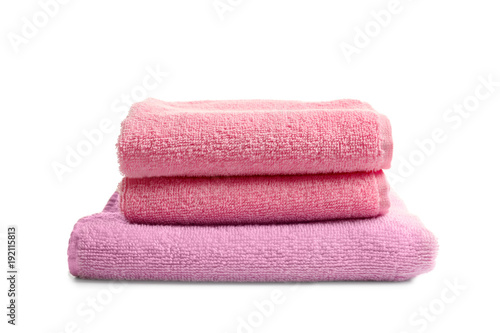 Folded clean terry towels on white background