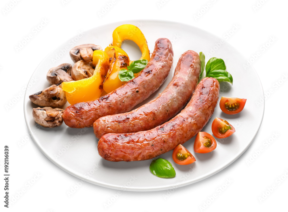 Plate with delicious grilled sausages and vegetables on white background Plate with delicious grilled sausages and vegetables on white background