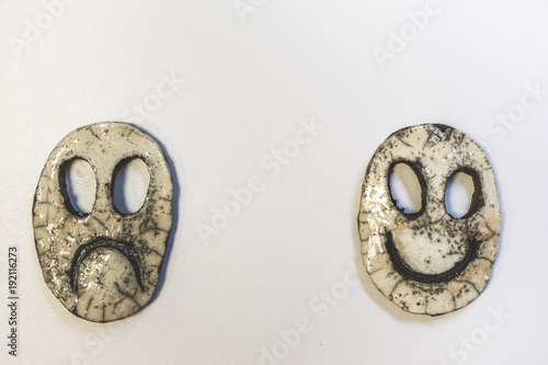 Quadro em tela Happy  and sad ceramic face on white background, theater, carnival or duality co