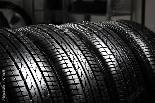 Car tires in automobile service center, closeup