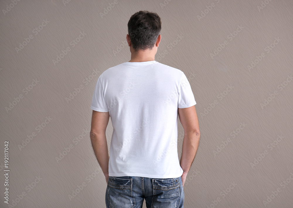 Man in color t-shirt on light background. Mockup for design Man in color t-shirt on light background. Mockup for design