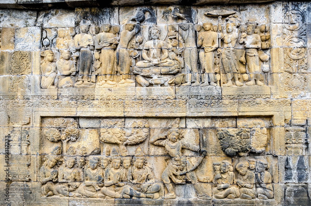 Detail of Buddhist carved relief in Borobudur temple in Yogyakarta, Java, Indonesia