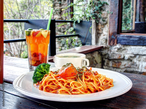 A plate of spaghetti bolognese on wooden table 