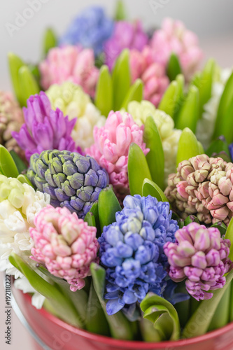 Fototapeta Naklejka Na Ścianę i Meble -  Flower shop concept. Mixed color. Fresh spring flowers in refrigerator room for flowers. Bouquets on shelf, florist business.