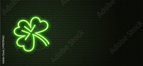 St Patricks Day Neon sign and green brick wall. Realistic sign. National holiday symbol in Ireland. Irish Shamrock. Template night horizontal banner.