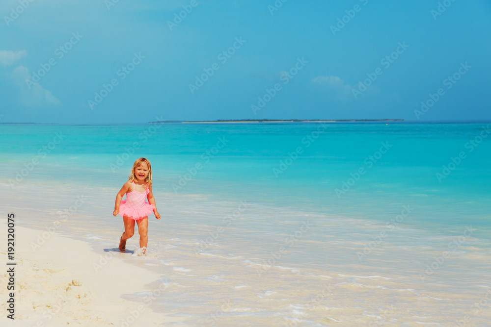 little girl run play with waves on beach little girl run play with waves on beach