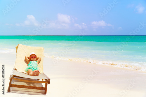 little girl relaxed on summer beach