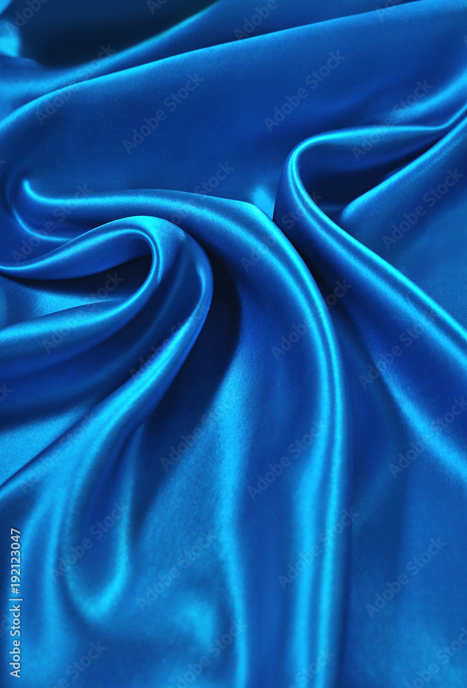 Fototapeta premium Natural blue satin fabric as background
