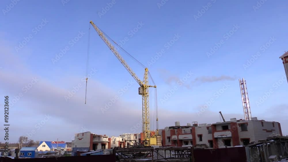Big yellow construction crane in winter Big yellow construction crane in winter