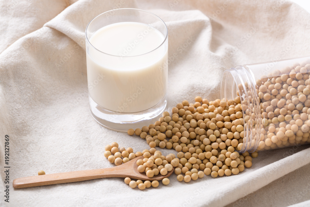 Closeup of soybeans and soy milk in a glass. Closeup of soybeans and soy milk in a glass.