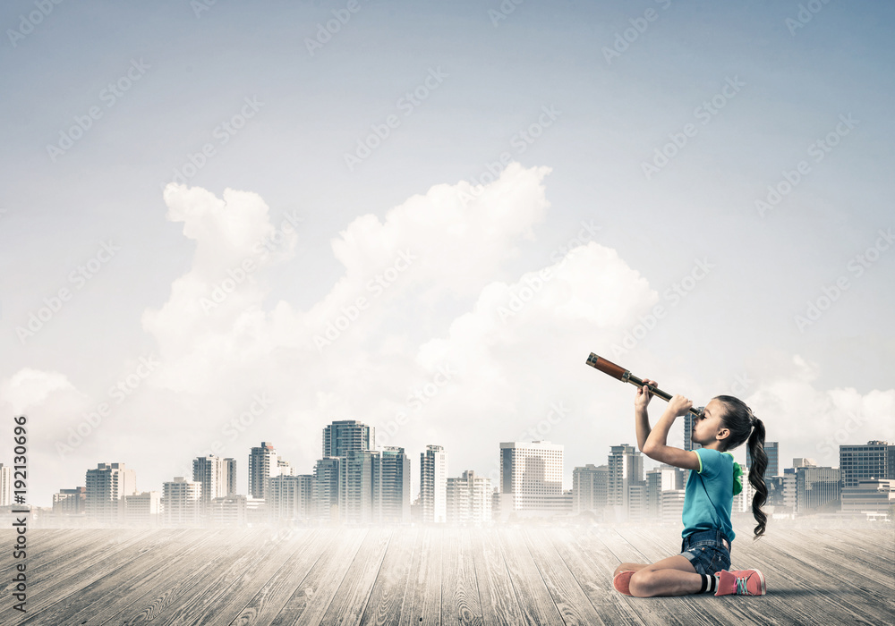Concept of careless happy childhood with girl dreaming about fut Concept of careless happy childhood with girl dreaming about fut