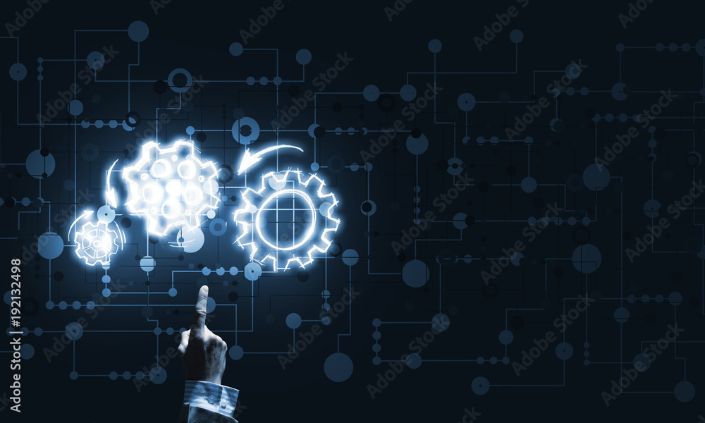 Glowing cogwheel mechanism icon on dark background as symbol of teamwork Glowing cogwheel mechanism icon on dark background as symbol of teamwork