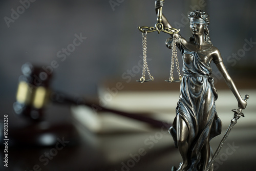 Law and Justice concept. Brown wooden background photo