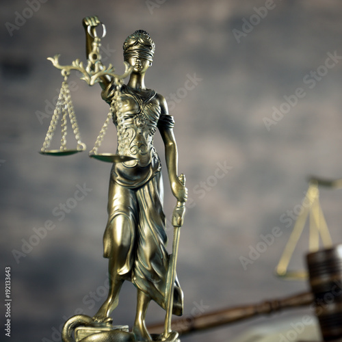 Law and Justice concept. Brown wooden background © Aerial Mike