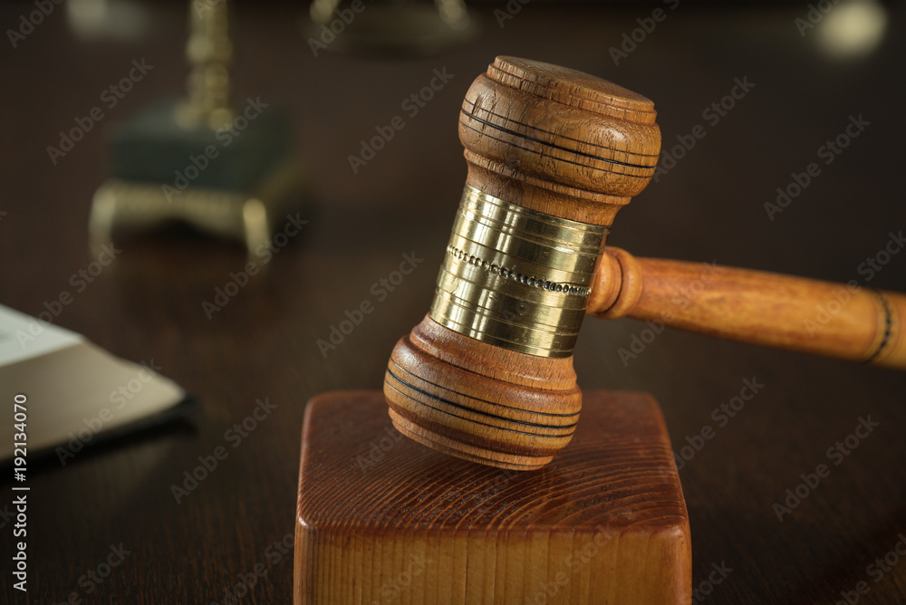 Law and Justice concept. Brown wooden background