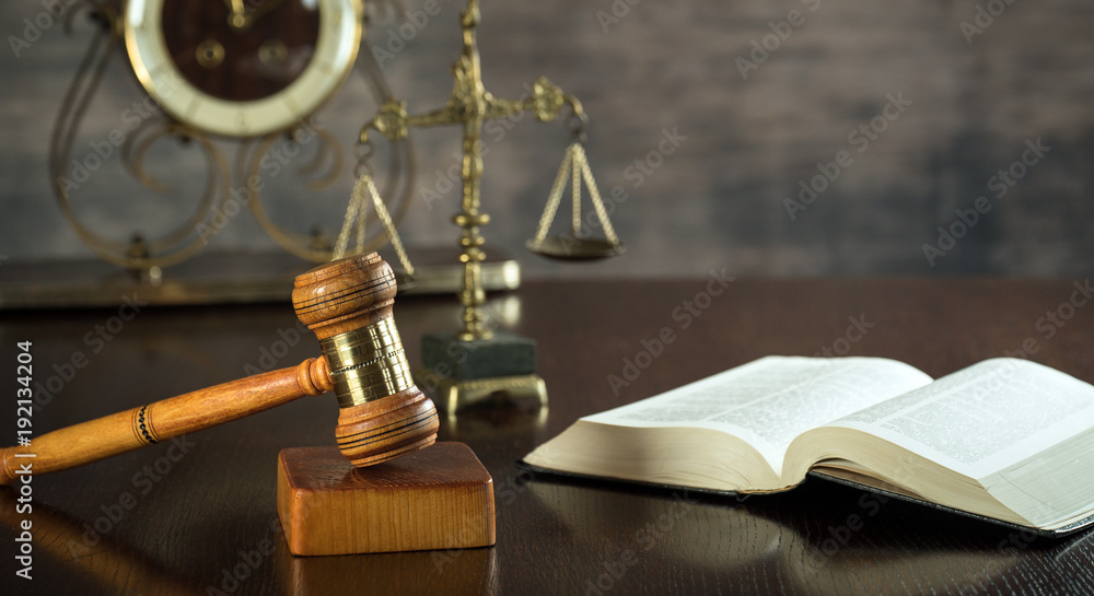 Law and Justice concept. Brown wooden background