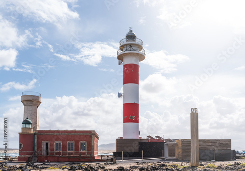 El Toston lighthouse in the north of island of Fuerteventura under beautiful sky
