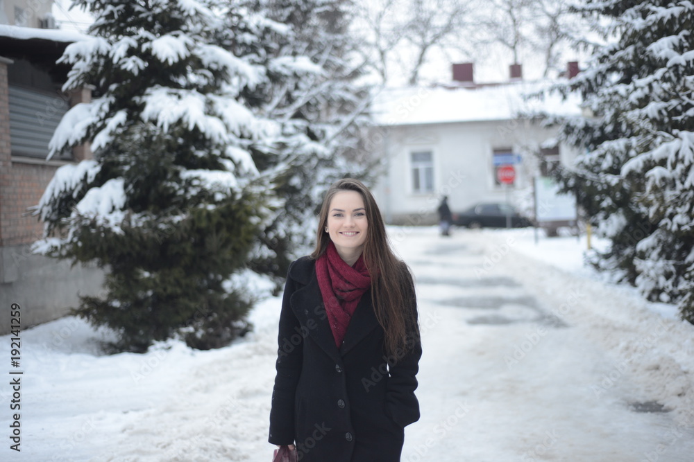 Handsome smiling girl in winter park Handsome smiling girl in winter park