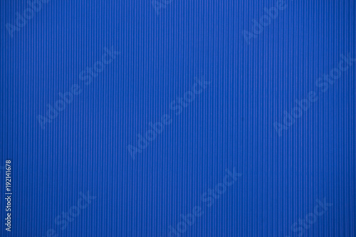 Dark blue colored corrugated cardboard texture useful as a background