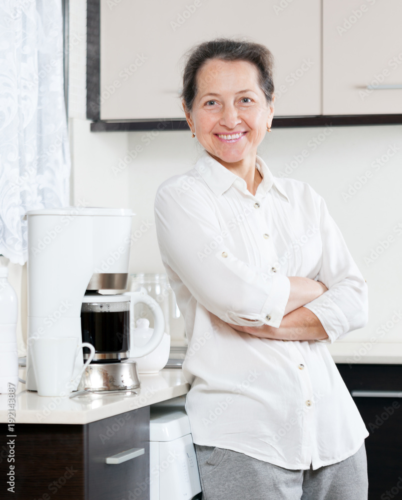 Smiling woman in kitchen Smiling woman in kitchen