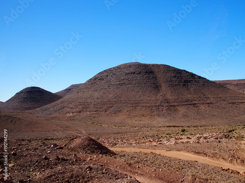 Rocky Atlas Mountains range landscape in southeastern Morocco near old village of Oulad photo