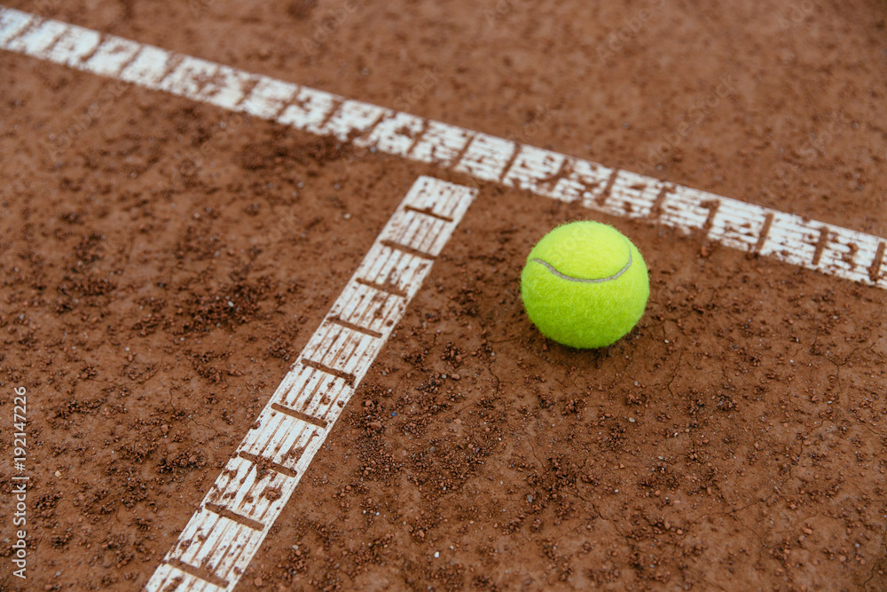 Tennis ball on the court, close-up. Sport concept.