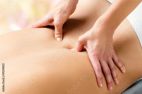 Wallpaper Mural Therapist doing lower lumbar massage on woman. Torontodigital.ca