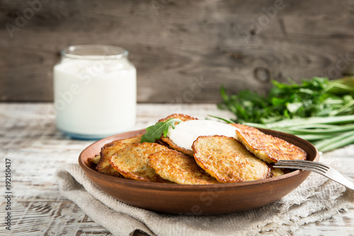 Draniki - potato fritters. potato pancakes. The naitonal dish of Belarus, Ukraine and Russia. photo