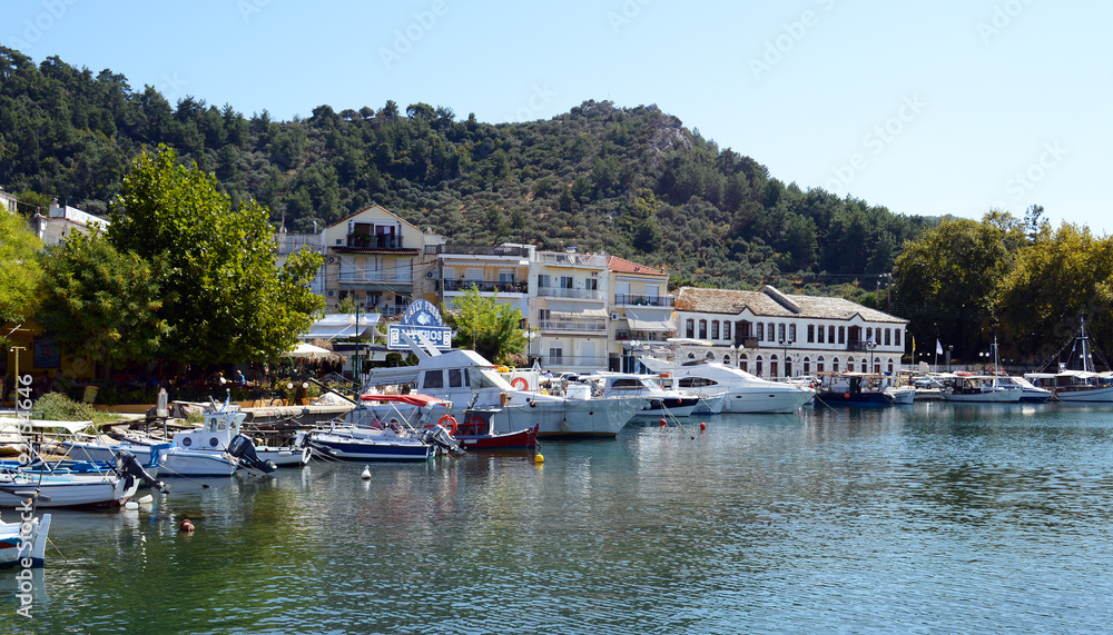 THASSOS, GREECE- September 13, 2015: Traditional Fishing boats in old Thassos harbor ( Limenas ), in Thassos island, Greece THASSOS, GREECE- September 13, 2015: Traditional Fishing boats in old Thassos harbor ( Limenas ), in Thassos island, Greece