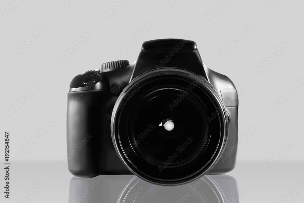 DSLR camera isolated on gray background