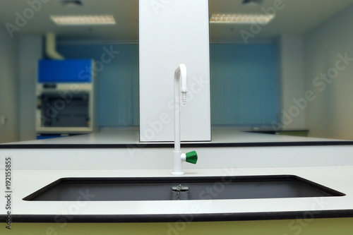 Sink and tap in chemical laboratory of science classroom.