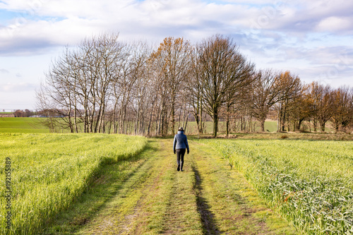 Woman is running on meadow path © Edler von Rabenstein