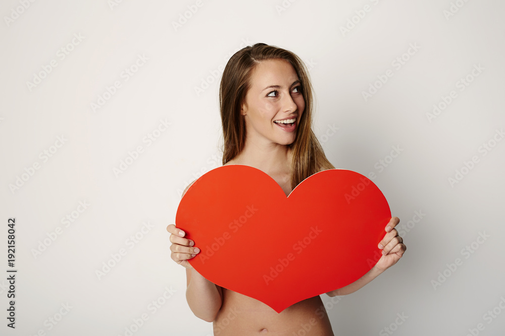 Beautiful woman with a Valentine heart, studio Beautiful woman with a Valentine heart, studio