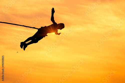 silhouette of a boy performs parkou. background of the display parkou concept © PRASERT